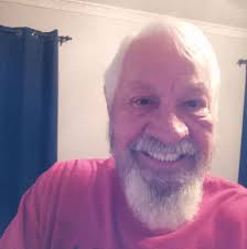 What car was he racing against in 1965 song?