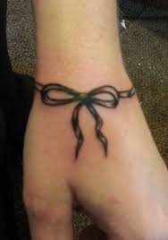 These days, ribbon tattoo has become a well known tattoo thought for ladies, maybe on account of it's ladylike appeal and assortment of placements it tends to be inked. Bow Tattoo Tattoo Picture At Checkoutmyink Com Bow Tattoo Ribbon Tattoos Tattoos