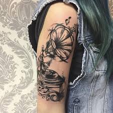 Great skull tattoo design under a guitar shows how bold your personality is and you are a fearless person. 35 Awesome Music Tattoos For Creative Juice