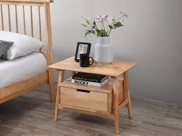 This modern, glass coffee table is designed with an elegant gold trim and an open, round shape the open design creates a welcoming feeling and provides ample space to put drinks or decor on top. Rome Bedside Tables Natural Hardwood On Sale