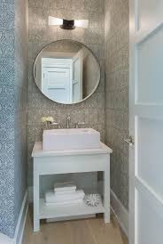 Stunning Small White And Gray Powder Room Is Equipped With A White Bath Vanity Fitted With A Shel Powder Room Vanity Small Bathroom Vanities Powder Room Design