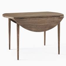 The elegant intersecting circle design on the metal base is finished in a burnished pewter coloration, giving the table a sophisticated, yet casual look. Modern Farmhouse Round Drop Leaf Expandable Dining Table West Elm Expandable Dining Table Dining Table Round Marble Dining Table