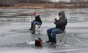 See people ice fishing at Ada Hayden Park in Ames