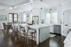 Open Concept Kitchen With White Shaker Cabinets Keeps A Consistent Light Streamlined Theme With White Wall White Kitchen Open Concept Home White Modern Kitchen
