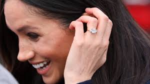 Meghan markle shows off engagement ring at prince harry's side. Meghan Markle Has Apparently Changed Her Engagement Ring