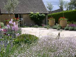 Country Garden Design In Gloucestershire First Summer After Autumn Planting A Bit Of Medi Mediterranean Garden Design Country Garden Design Country Gardening