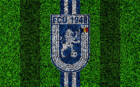 Clubul a apărut în anul 2013, ca urmare a asocierii dintre primăria craiova, clubul sportiv universitatea craiova și sc blue lions capital sa. Download Wallpapers Cs Universitatea Craiova 4k Logo Football Lawn Romanian Football Club Blue White Lines Grass Textur Craiova Sports Wallpapers Football Club