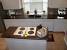 Baltic Brown Granite With Black Cabinets