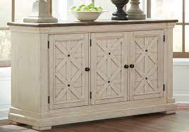 Set a white round dining table in your dining space for a soft and sleek appearance. Bolanburg White Gray Dining Room Server