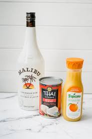 I came up with this one a few years ago, and it's still a big hit as a party drink (partly because it's easiest to make in a large pitcher). Winter Sunshine Coconut Rum Cocktail The Delicious Spoon