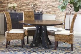 Natural banana leaf dining chair with white cushion. Seating For Round Dining Tables James James