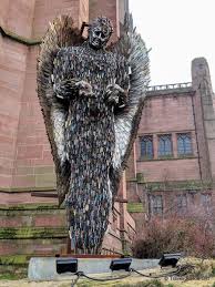 The tines of forks and steak knives form wing feathers, and slotted. Knife Angel Contemporary Sculpture Monumental Memorial Travel Junkie Girl