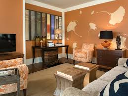 Want to warm up your living room? Burnt Orange Living Room With Book Binding Art Hgtv