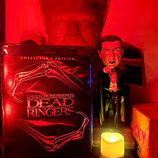 Dead Ringers (1988) slithers under your skin like cold surgical steel  kissed with perfume. Jeremy Irons, in a performance that feels like two  separate souls sharing one bloodstream, plays the Mantle twins—identical,