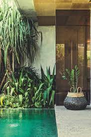 Palms Around The Iridescent Green Pool At The Slow Bali S Coolest Hotel Balis Coolest Green Hotel Boutique Hotels Design Hotels Design Exterior Design