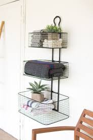 How To Fit A Whole Lot Of Storage Into A Foot Or Two Of Wall Space Baskets On Wall Metal Wall Basket Bathroom Wall Storage