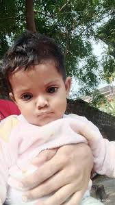 My baby girl at 7 months Big or too small She's playing she know how to  play very well