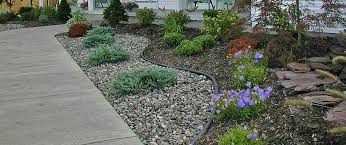 Pebbles are used as a filler instead of traditional mulch. Mulch Rock Installation Buffalo Lancaster East Amherst Ny Buffalo Lawn Pest Control