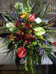 This funeral flowers directory includes funeral flower supplier entries for many states in the usa plus washington, dc. Funeral Spray With Tropical Flowers Funeral Stand Sympathy In Fresno Ca Flowers And More