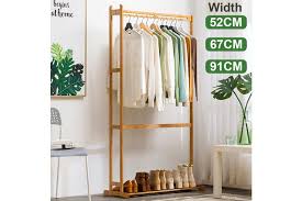 Try the tlbtek industrial clothes rack. Clothes Cabinet Simple Solid Wood Coat Rack Hanger Floor Bedroom Storage Rack Living Room Clothes Rack Kogan Com