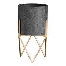 Add pops of green to your tabletop with small indoor plants like succulents or terrariums. Hoven Small Round Metal Planter Pot Metallic Gold Stand 26cm Diameter