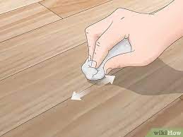 Start by scraping off any hardened wax with a butter knife. 3 Ways To Repair Laminate Floor Scratches Wikihow