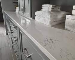 Carrara Marmi Quartz Features Subtle Veining That Adds Timeless Character Use These Beautiful Slabs To Quartz Countertops Countertops White Quartz Countertop
