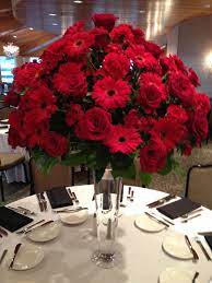 Centerpiece 22 Inch Pilsner Vase Topped With Arrangement Of Red Roses Red Gerbera Daisi Daisy Centerpieces Gerbera Daisy Centerpiece Carnation Centerpieces