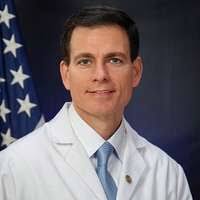 A cartoon doctor giving a thumbs up. Dr adriano miranda.