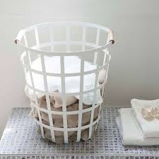 Cute round shaped basket with rope handles. Tosca Round Laundry Basket Williams Sonoma