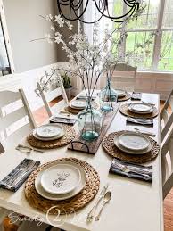 The pretty white tulips inspired me to freshen up the dining room this afternoon with a few simple touches of spring. Spring Dining Room Simple Neutral Tablescape Simply2moms