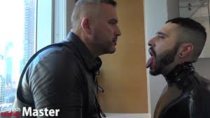 Mature leather Master spitting on a latex slaves rubber gimp mask face  spits in his mouth PREVIEW