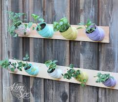 Plant your favorite succulents or other trailing plants in a modern hanging planter, which you can create out of pvc pipes. Pvc Pipe Vertical Garden The Kim Six Fix