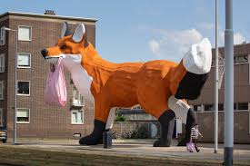 He is known for playful urban installations such as the rubber duck and the florentijn hofman was born on 16 april 1977 in delfzijl in the netherlands. Gripping A Plastic Bag A Massive Fox By Artist Florentijn Hofman Towers Over Rotterdam Colossal