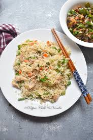 A stir fry with chicken, rice, soy sauce and veggies like peas, carrots, celery and bell peppers. Chicken Fried Rice Recipe Restaurant Style Chinese Fried Rice Pepper Chilli And Vanilla