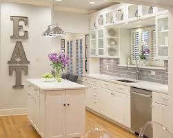 Every wall, cabinet, trim, ceiling, door in this house is painted with simply white and i couldn't be happier. White Kitchen In Benjamin Moore S Simply White Transitional Kitchen Austin By Paper Moon Painting Houzz