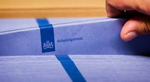 From middle dutch belastinge (burden, accusation). Nooit Eerder Betaalden We Zo Veel Belasting Trouw
