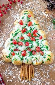 Preheat oven to 375° and line a large baking sheet with parchment paper. The Best Cheesy Christmas Tree Pull Apart Bread