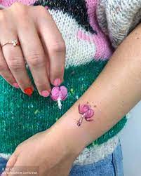 Tiny Alien Dicentra Flower Or Bleeding Heart Bleeding Heart Tattoo Heart Flower Tattoo Heart Tattoo Wrist