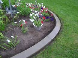 This is a perfect example of masonry edging, using bricks in different shapes and colors to create an edge to divide the plants from the garden path. Concrete Garden Edging Diy