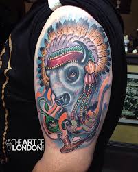 This is where the wearer can use a variety of colors that have a connection to them or to represent the colors of certain tribes that they are connected to through blood. Great White Buffalo Native American Headdress Tattoo By London Reese Tattoonow