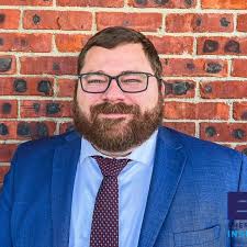 John Midwood, Insurance Agent