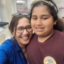 This is a picture of my daughter was recently diagnosed and her bearded  dragon. He helps her cope with some things.