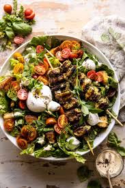 Pesto Chicken Caesar Salad With Tomatoes And Burrata Half Baked Harvest Recipe In 2020 Half Baked Harvest Recipes Harvest Recipes Chicken Caesar Salad