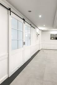 Easy installation and removal, great for renters or seasonal installation White Double Sliding Door With Glass Entrance To The Ballroom