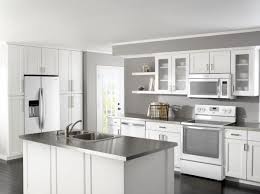 Custom white cabinetry, gray countertops and stainless steel appliances fill this elegant transitional kitchen. Pin By Mobelde On For The Home White Kitchen Appliances Kitchen Design Trends Kitchen Remodel