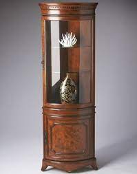 Beautiful cornerstones below eye level when seated dinner this kind of curio cabinet ikea is well designed with wood or metal trim on sides or back with glasses on rest of way close. Butler Specialty Corner Curio Cabinet Olive Ash Burl Finish 7039101 Butler Specialty Furniture Corner Curio Corner Curio Cabinet Curio Cabinet