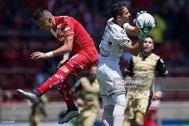 Fernando Uribe Of Toluca Fights For The Ball With Luis Michel Of Toluca Fight Diez