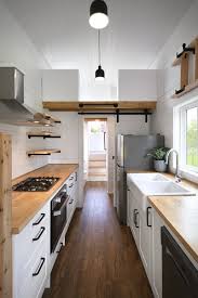 Resilient vinyl plank flooring averages less than $1.50 per square foot, is easy to install by simply cutting to size with a utility knife, then staggering each plank to create a pattern. Best 50 Modern Kitchen Vinyl Floors Design Photos And Ideas Dwell