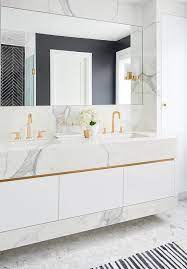 The veining in white carrara marble is mainly grey with light to a white background, but carrara can also have a slight gold tint to. White Marble Washstand With Gold Trim Modern Bathroom